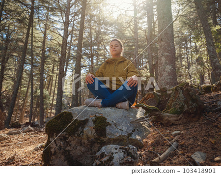 caucasian woman enjoys being in nature, 103418901