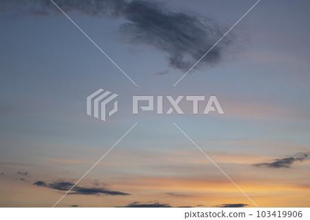 Blue and pink clouds in the evening sky 103419906