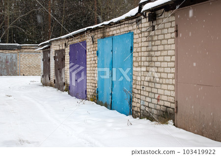 Garage doors in a row in the snow Garage doors in a row in the snow 103419922