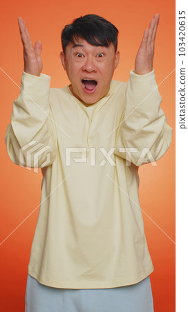 Excited amazed man showing head explosion, looking worried shocked surprised guy, wow idea eureka Excited amazed man showing head explosion, looking worried shocked surprised guy, wow idea eureka 103420615