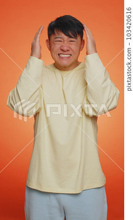 Handsome chinese man loses becoming surprised by lottery results, bad fortune, loss, unlucky news Handsome chinese man loses becoming surprised by lottery results, bad fortune, loss, unlucky news 103420616