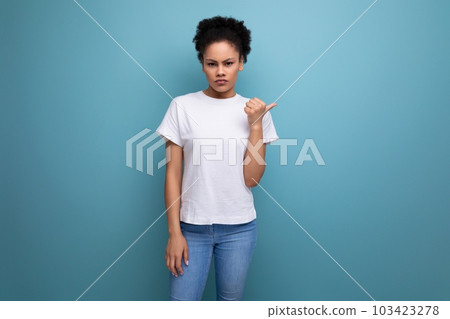 confused owner of curly hair woman dressed in a white t-shirt confused owner of curly hair woman dressed in a white t-shirt 103423278