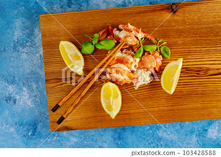 Delicious ocean food meal at Fresh lobster is cooked perfection in our gourmet dinner kitchen served with lemon 103428588