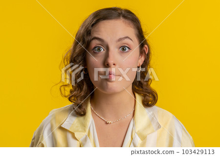 Funny comical playful young woman making fish grimace pout lips, smooching choking doing duck face Funny comical playful young woman making fish grimace pout lips, smooching choking doing duck face 103429113