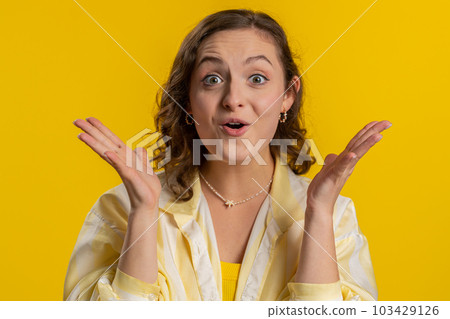 Excited amazed woman surprise looking at camera with big eyes, shocked by sudden victory wow emotion Excited amazed woman surprise looking at camera with big eyes, shocked by sudden victory wow emotion 103429126