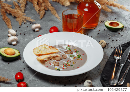 Mushroom cream soup and ingredients on grey background, close up 103429877