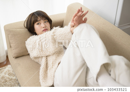 young woman lying on the sofa young woman lying on the sofa 103433521