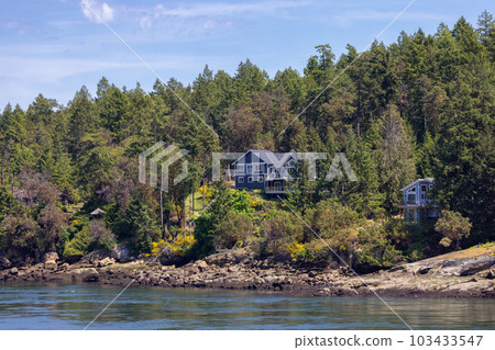 Cabin on a Rocky Shore on the West Coast of Pacific Ocean. Canadian Nature Background. Cabin on a Rocky Shore on the West Coast of Pacific Ocean. Canadian Nature Background. 103433547