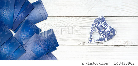 Concept of divination, magic and esotericism. Cards candle on cartomancy table. Concept of divination, magic and esotericism. Cards candle on cartomancy table. 103433962