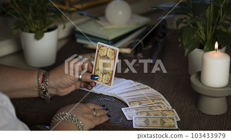 Concept of psychic advisor or ways of divination with cards. 103433979