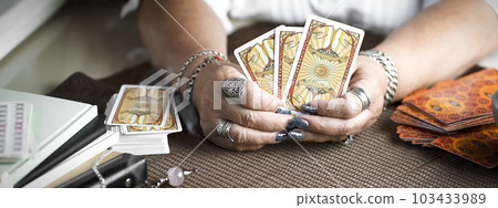 Concept of psychic advisor or ways of divination with cards. 103433989
