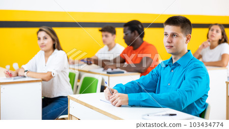 Young man attending lecture in taxi training school Young man attending lecture in taxi training school 103434774