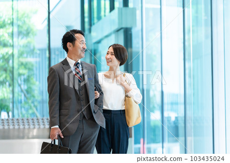 A couple in a suit dating after work 103435024