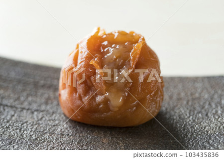 Sizzle photo of an open umeboshi Sizzle photo of an open umeboshi 103435836