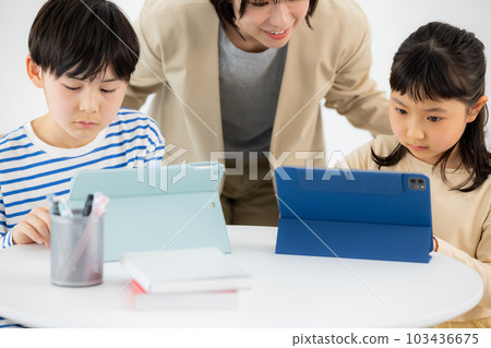 Elementary school students tablet learning Elementary school students tablet learning 103436675