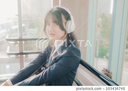 high school girl sitting on a bench 103436748