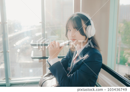 high school girl sitting on a bench 103436749