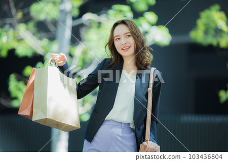 A woman walking outdoors 103436804