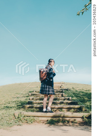 A high school girl standing in the sky 103436829