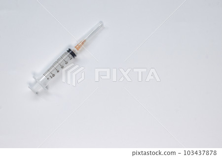 Syringe 5 ml with needle on white background, top veiw. 103437878