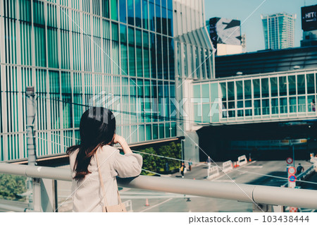 Female college student standing in the city 103438444