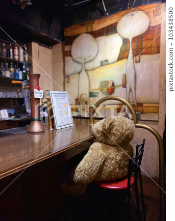 teddy bear sitting on bar counter teddy bear sitting on bar counter 103438500