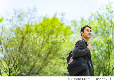 A man walking in the park 103438781