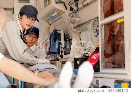 An image of an ambulance worker using a stethoscope An image of an ambulance worker using a stethoscope 103439143