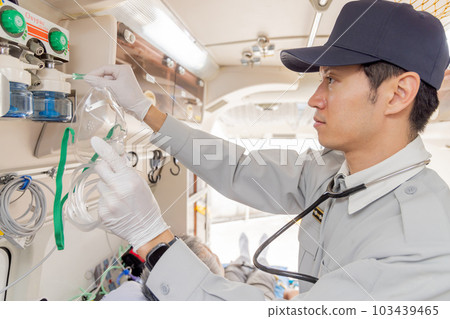 Paramedics using oxygen inhalers Paramedics using oxygen inhalers 103439465