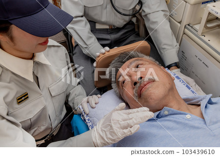 Paramedics calling out to patients to check their consciousness Paramedics calling out to patients to check their consciousness 103439610