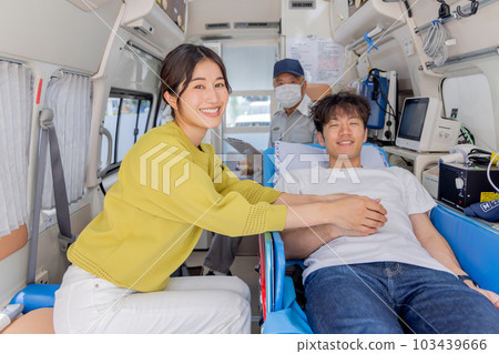 Young man saved by paramedics Young man saved by paramedics 103439666