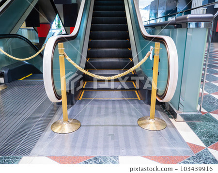 Stopped and off-limits escalator Stopped and off-limits escalator 103439916
