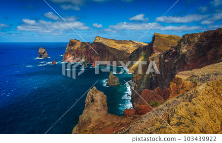 Volcanic sea cliffs of the Sao Lourenco peninsula, eastern Madeira, Portugal, Atlantic Ocean 103439922