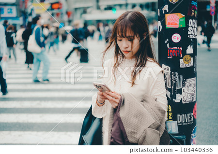 Taiwanese woman walking at the crossroads 103440336
