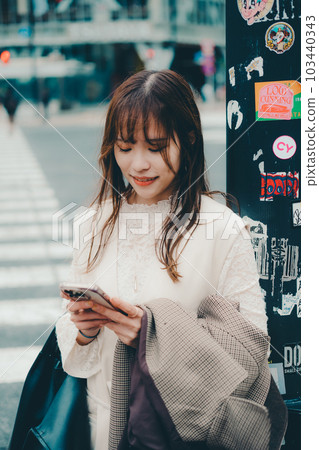 Taiwanese woman walking at the crossroads Taiwanese woman walking at the crossroads 103440343