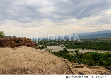 View on the Kura river and Caucasus mountains from Ancient cave city Uplistsikhe, Georgia 103442348