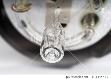 Studio light flash lamp closeup on white background isolated 103445517