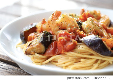 Pasta with chunky shrimp and summer vegetables in spicy tomato sauce Pasta with chunky shrimp and summer vegetables in spicy tomato sauce 103445609