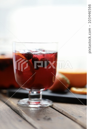 Refreshing iced herbal tea with plenty of fresh fruit Refreshing iced herbal tea with plenty of fresh fruit 103446566