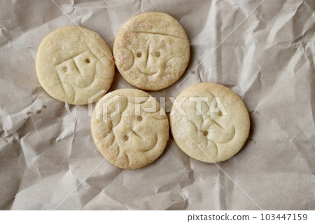 Simple cookies with faces drawn on them - Baked goods 103447159