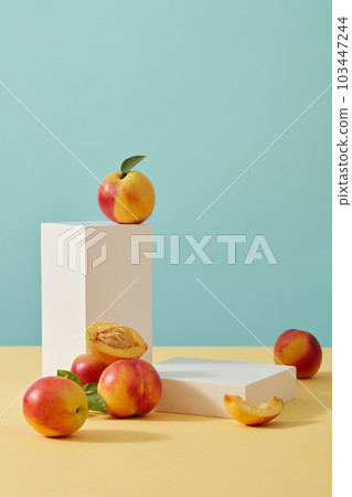 Creative composition with two white podiums and fresh Peach (Prunus persica). Concept scene stage showcase for new product, promotion sale, cosmetic presentation 103447244