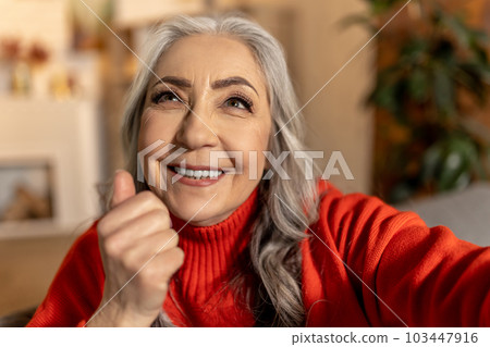 Smiling senior woman looking beaming and positive 103447916