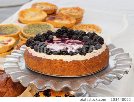 Fresh forest fruit cheesecake at the bakery stand at the farmers market 103448093
