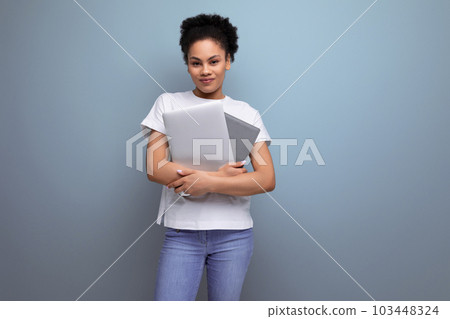 young successful hispanic brunette woman student studying to be a programmer. laptop in the frame young successful hispanic brunette woman student studying to be a programmer. laptop in the frame 103448324