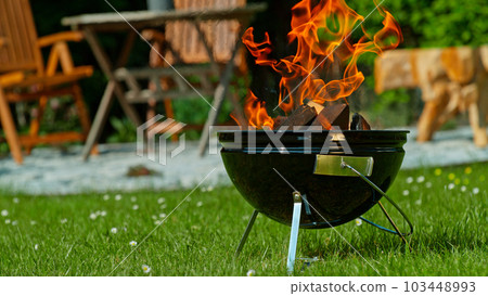 Heating Up the Garden Grill during Sunny Day 103448993