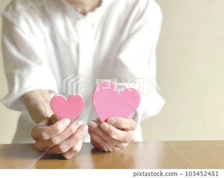 Elderly woman with two hearts_right space 103452481
