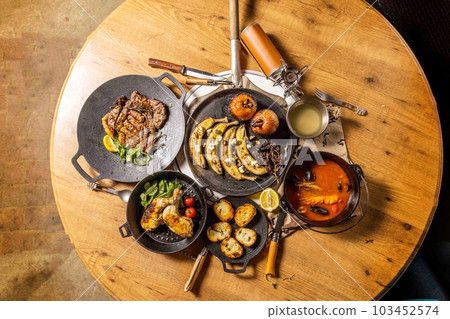 Title Food using a bonfire at the campsit 103452574