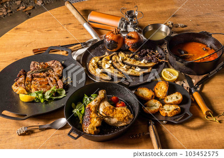 Title Food using a bonfire at the campsit 103452575