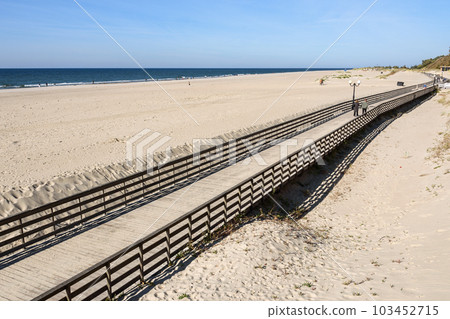 Wooden promenade along the Baltic Sea coas. Yantarny. Kaliningrad region. Russia 103452715