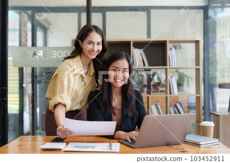 Asian Business team makes analysis and research financial report at office, analyzes profits. Accountant checks status of financial Asian Business team makes analysis and research financial report at office, analyzes profits. Accountant checks status of financial 103452911